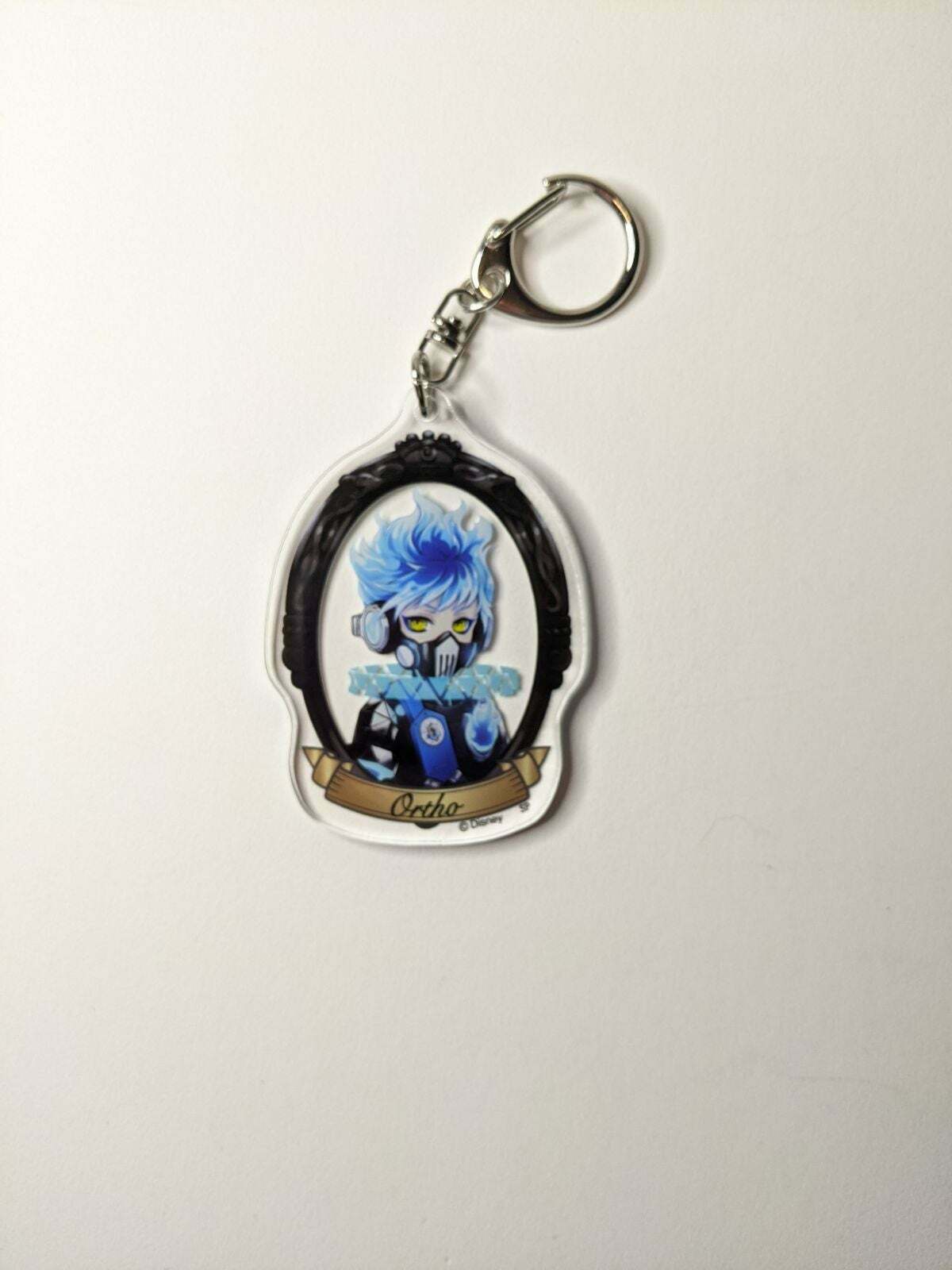 Ortho Shroud Twisted Wonderland Acrylic Keychain